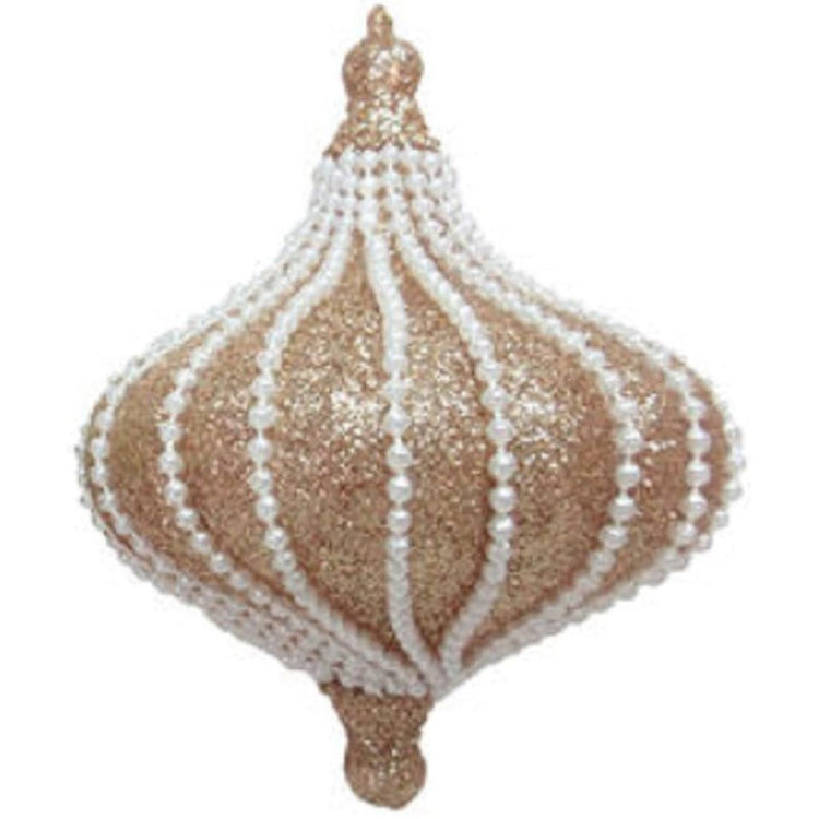 onion shaped glass ornament covered in champagne color glitter and pearl beads.