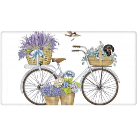 White bike with lavender & hydrangeas & a Dachshund in the basket.
