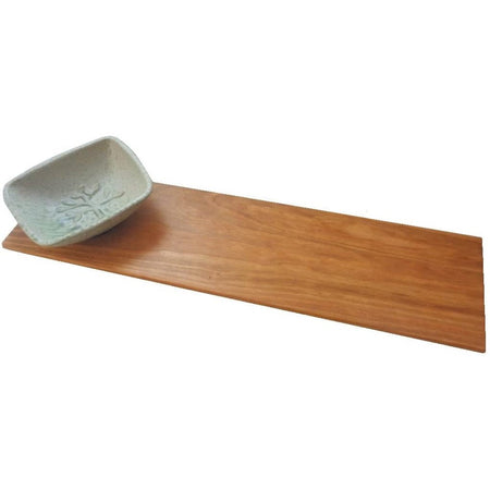 Rectangle shaped wood bread board with pottery rectangle shaped bowl imprinted with a tree.