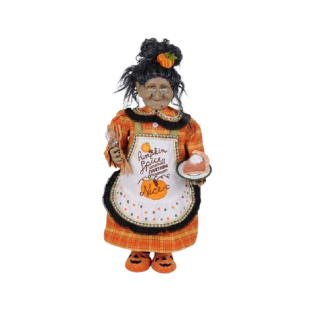 Granny witch with an orange plaid dress & pumpkin pie in her hand.