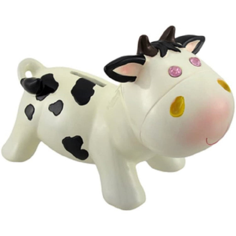 Black and white cow shaped piggy bank with pink jewel eyes.