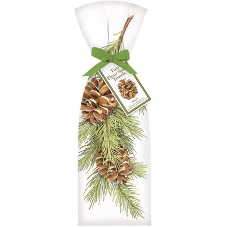 2 white towels with green pine branch with pinecones on it