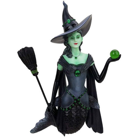 Mermaid shaped figurine ornament.  Green body, dressed in black as a witch with hat broom and carrying a green ball.