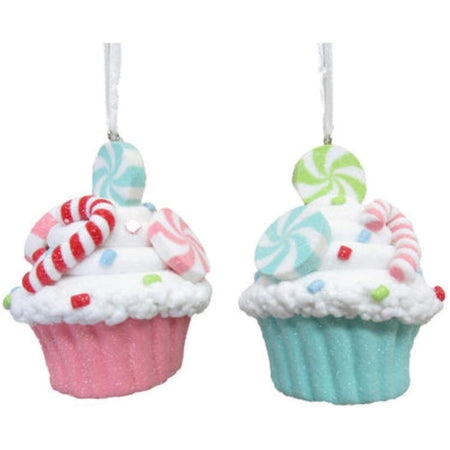 Two cupcake ornaments, one has a pink liner and one has a light blue. both have circle peppermints and a candycane.