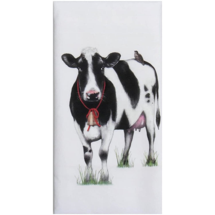 Black & white farmhouse cow with a bell on & a bird on its back.