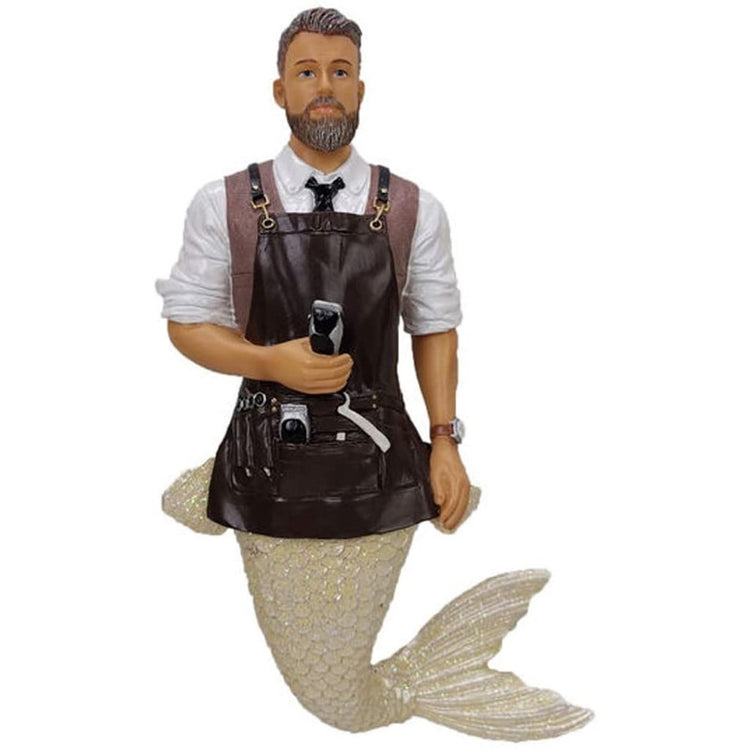 Merman shaped figurine ornament.  Dressed as a barber with apron, tools and carrying a razon.