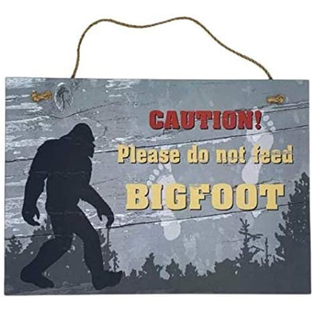 sign that says "CAUTION! Please do not feed BIGFOOT"