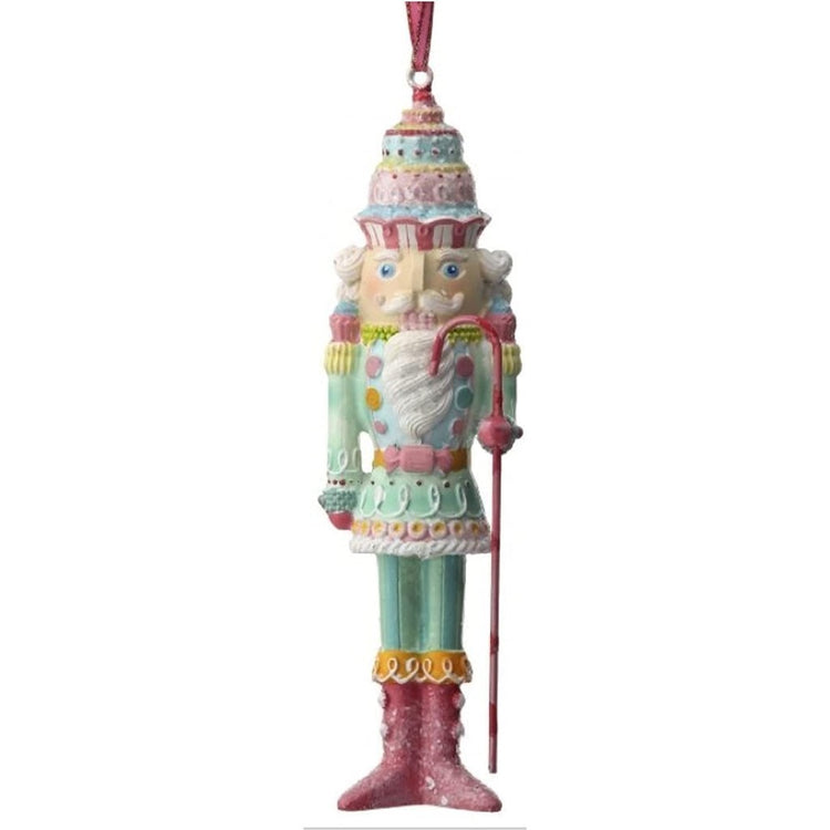 Pastel pink & blue nutcracker ornament with candy on it.