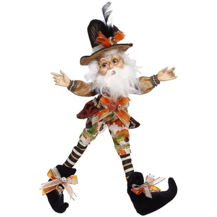 Bearded elf in leaf patterned pants, a black hat and boots