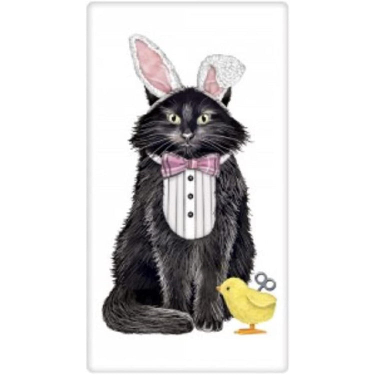 white flour sack towel with long haired black cat wearing bunny ears and a toy chick.