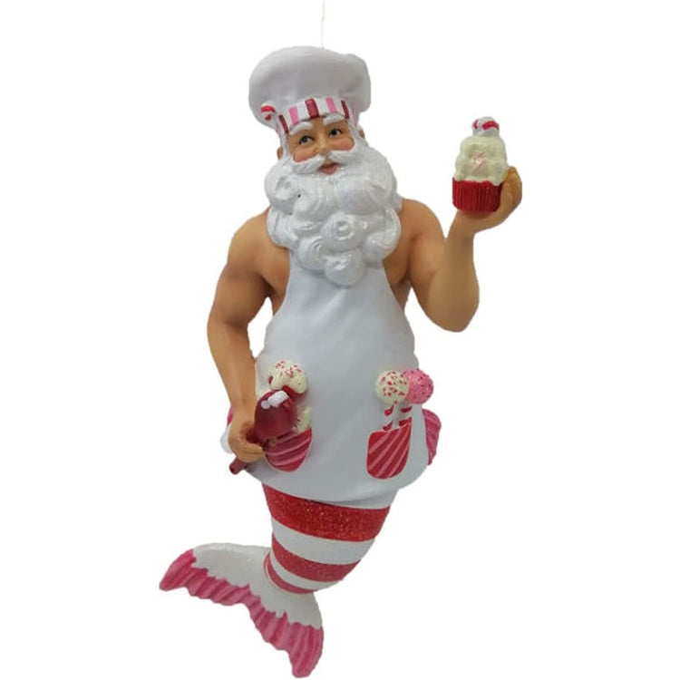 Santa Merman wearing a chefs hat, apron and has a red and white striped tail, his apron pockets are full of baked goods.