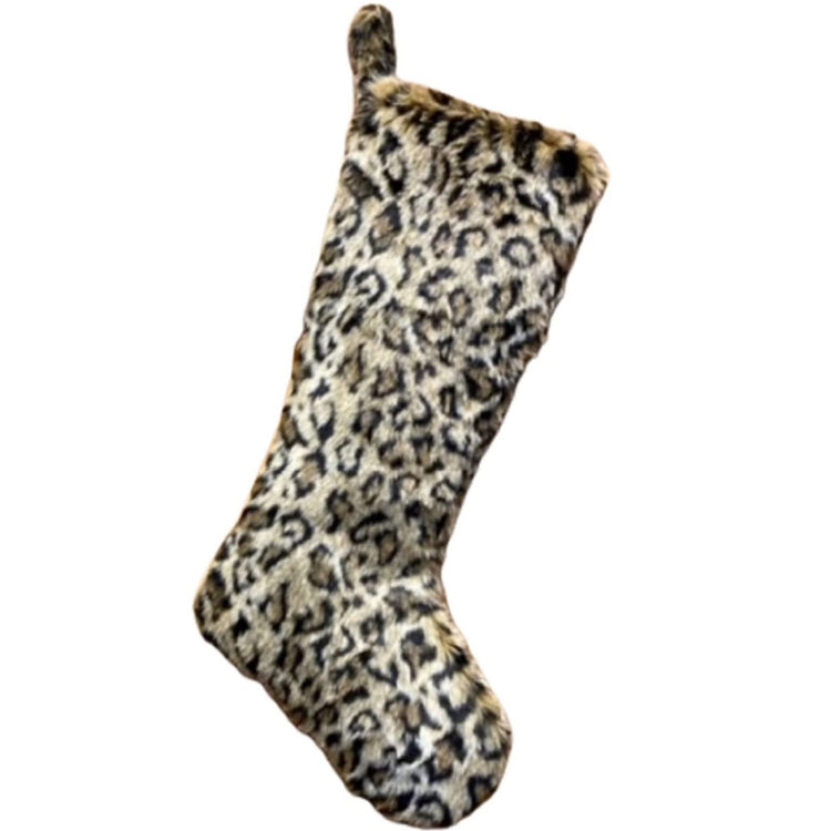 Holiday Stocking hanging by loop at top. Stocking looks like it made from leopard spotted fur.