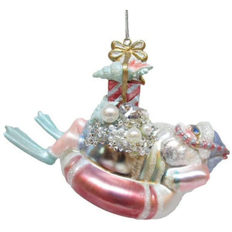 Pastel Santa in a pink float with flippers and presents. 