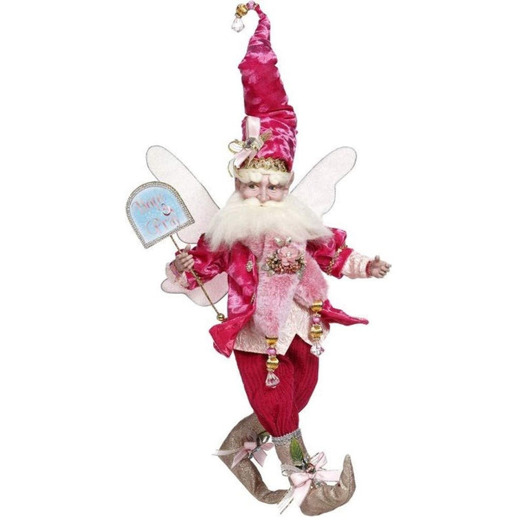 Bearded fairy wearing all pink suit including long pink stocking cap, he's holding a sign that says "hope and pray."