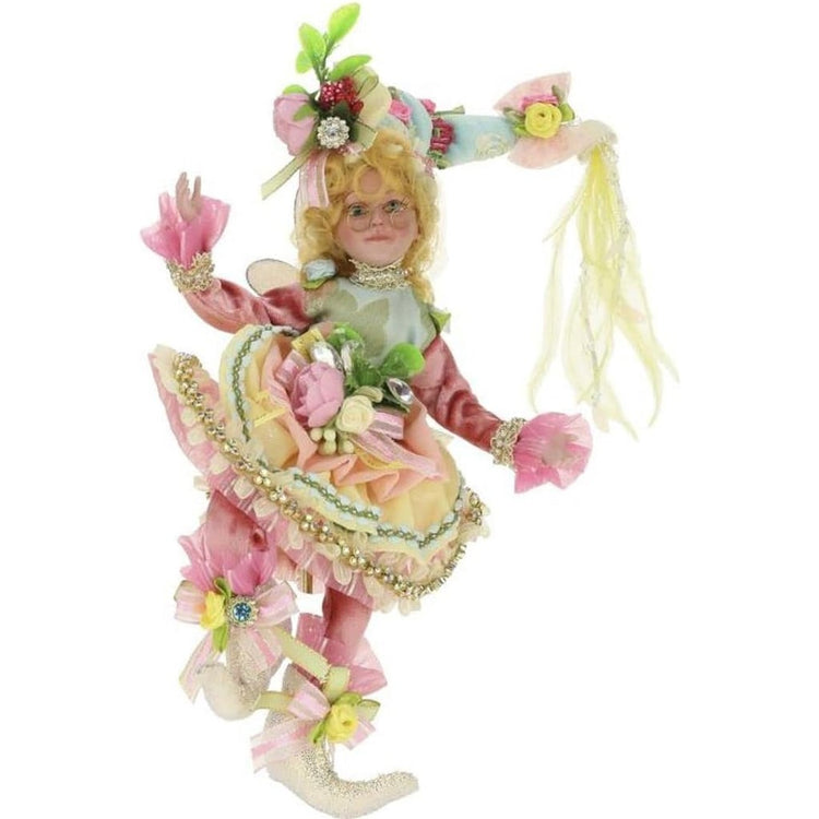 Fairy with blonde hair wearing a pink spring outfit.