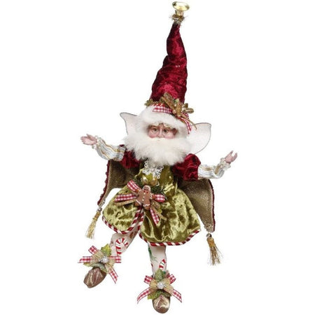 Bearded fairy wearing red and gold capelet, stocking cap, and green velvet top.