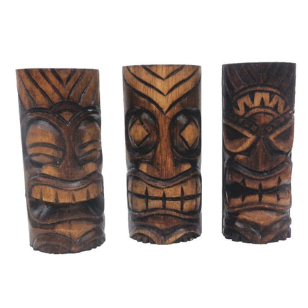 3 small, dark brown, carved wooden tiki totems.