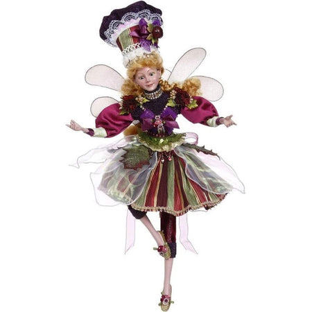 Girl fairy in red and green skirt with purple top and lacy hat
