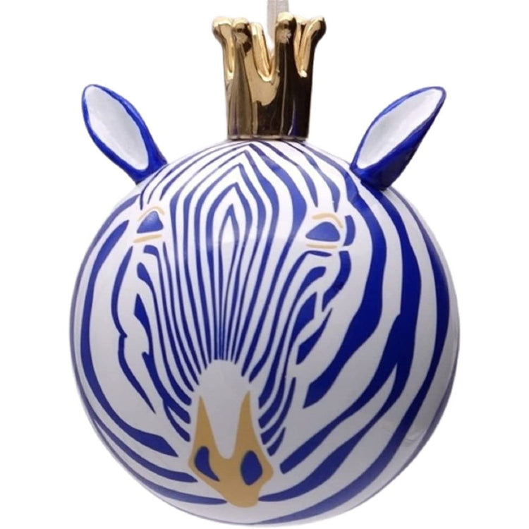 White ball ornament with blue zebra stripes & a gold crown on.