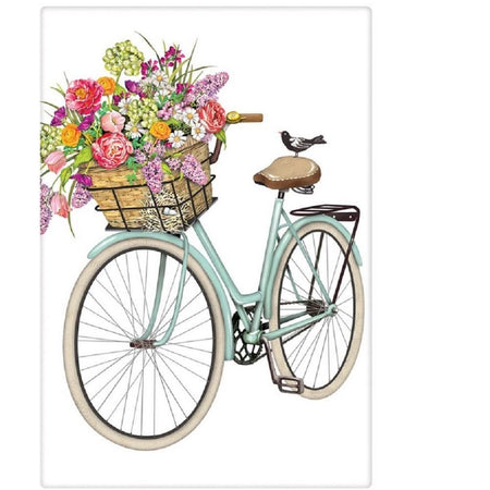 White towel with a light blue bike, basket full of flowers in pinks, yellows, and whites.