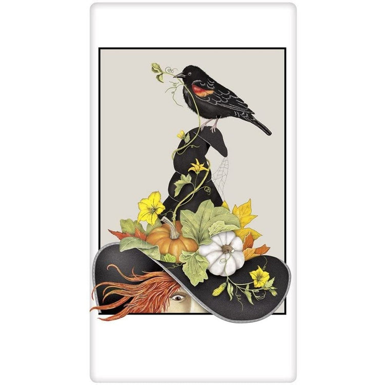 white towel with a red haired witch in a black hat with fall florals and pumpkins.