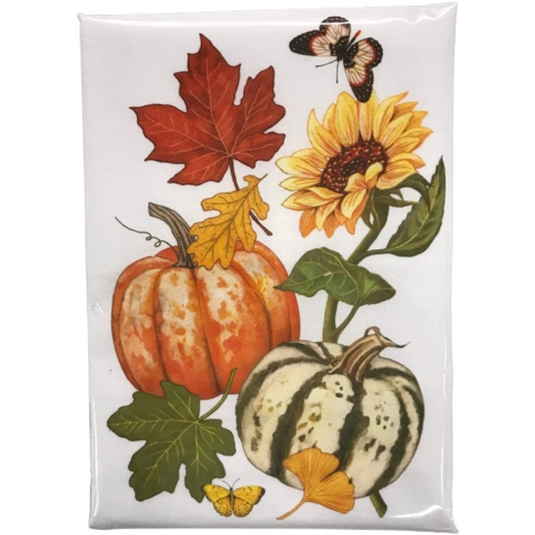 white flour sack towel with a sunflower, fall color leaves, orange pumpkin, and a white and green pumpkin.