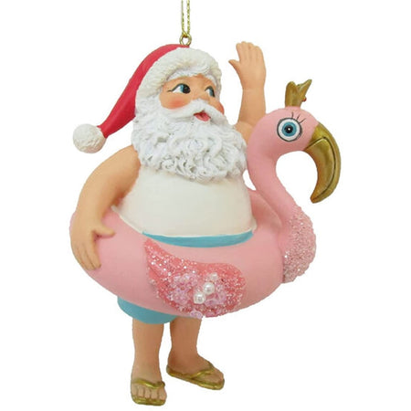 Santa in a tank with a pink flamingo floatie.