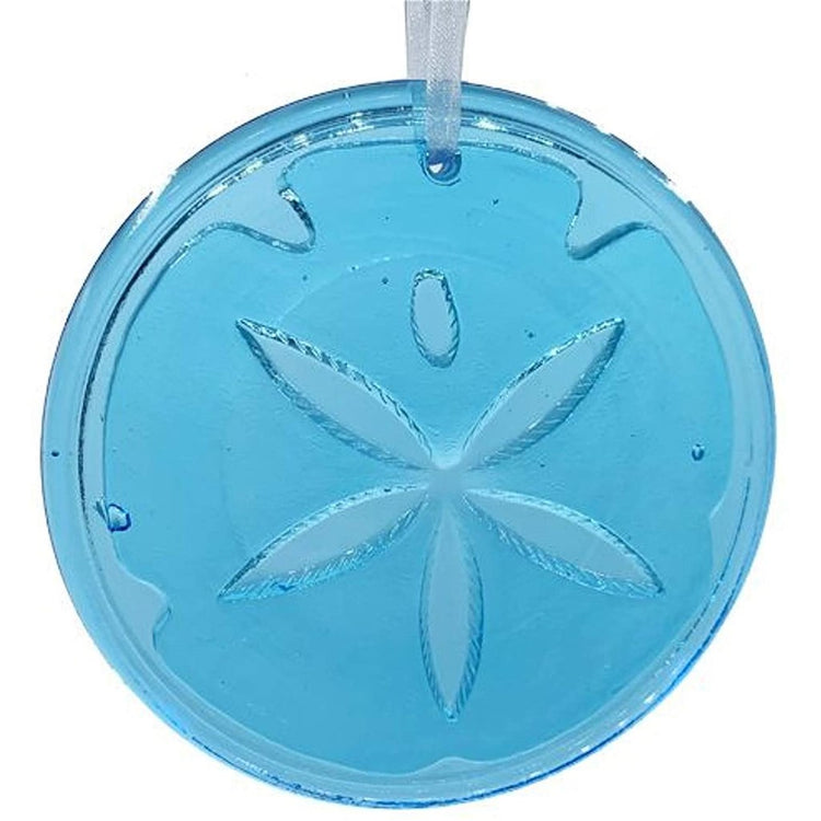 Teal glass suncatcher with a sand dollar on the front. 