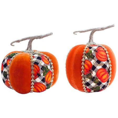 two pumpkins with orange velvet segments and black and white plaid pumpkin patterned segments separated by silver rhinestones.