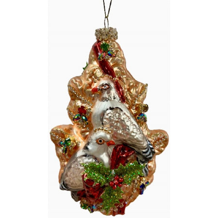 Blown glass ornament with a design of two turtle doves in a gold tree with jewel accents.
