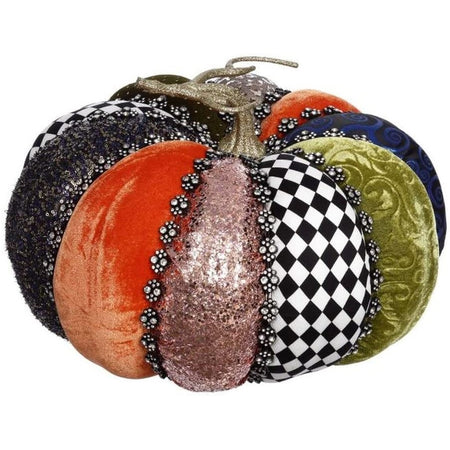 pumpkin figurine, sections made of green, orange, navy velvet, gold and black glitter, and black and white checks, all seperated by silver rhinestones.