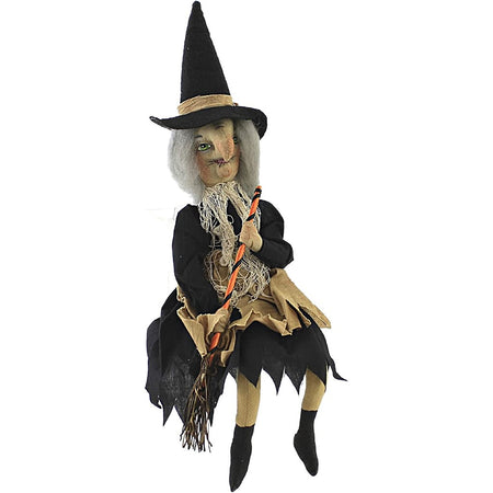 Grey haired witch with an orange & black broom.