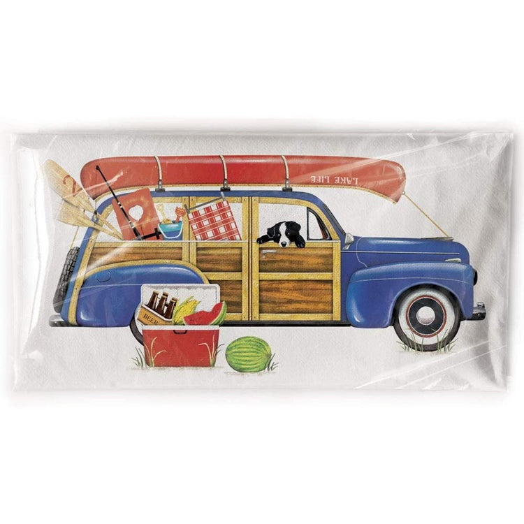 Blue woodie station wagon with a canoe & summer things on top & inside.