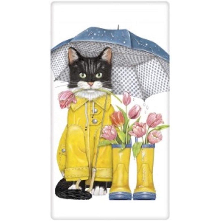 Black & white cat wearing a yellow raincoat with tulips in yellow rain boots.