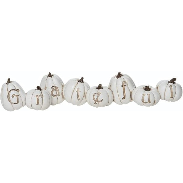 White pumpkins that spell out Grateful.