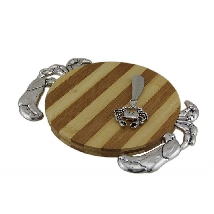 Round wood center cutting board with metal adornments to look like a crab.  Metal crab designed spreader.