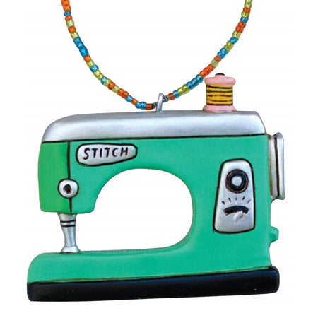 Green sewing machine ornament.