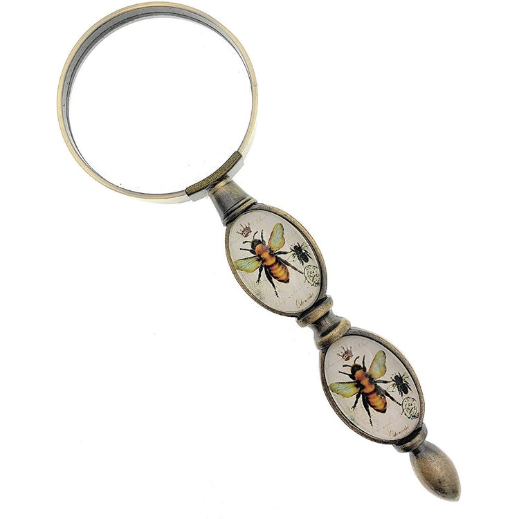 brass and glass magnifier glass with two glass pieces in the handle, showing bees with a crown.