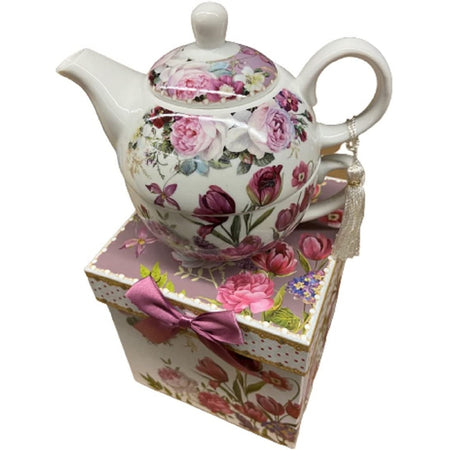 white teapot with purple and pink tulip print sitting on top of matching gift shop.