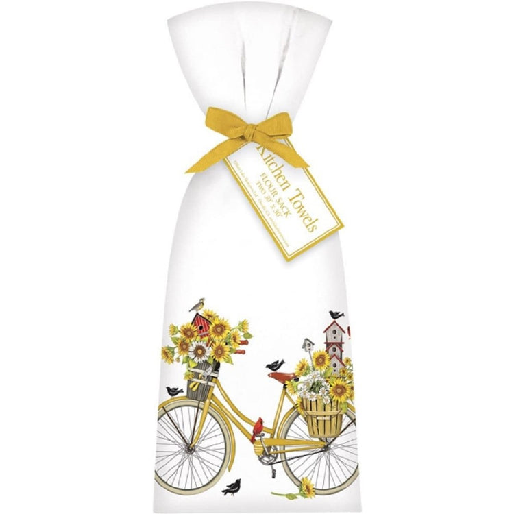 White towel with a yellow bike, birds & sunflowers.