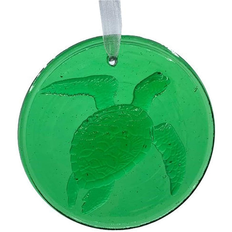 Green round & flat suncatcher with a sea turtle on it. 