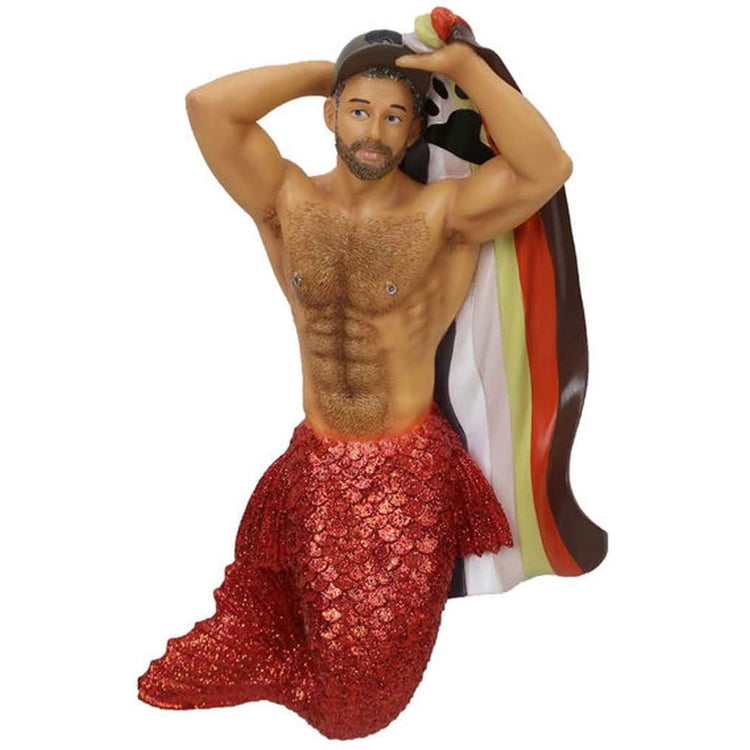 Merman shaped figurine ornament.   Red tail carrying a rainbow flag wearing a baseball cap.
