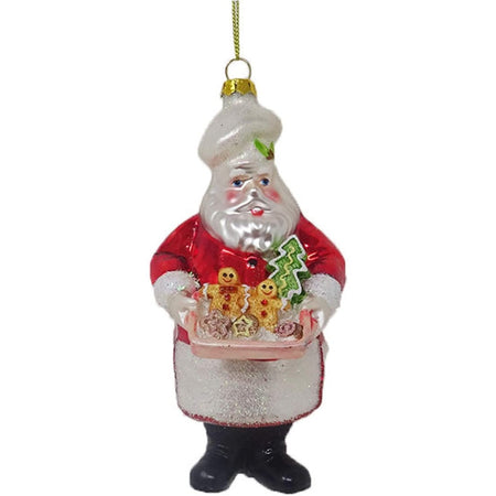 Blown glass santa ornament, santa is in an apron and chef hat, holding a tray of gingerbread cookies.