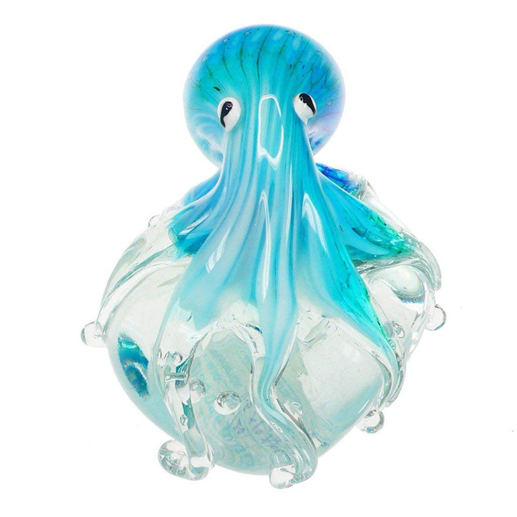 Multiple shades of blue glass octopus on clear ball. Octopus tentacles wrap around the ball.