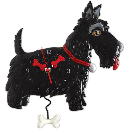 Clock shaped like a black scottish terrier with its tongue out, hands of clock and pendulum are shaped like dog bones