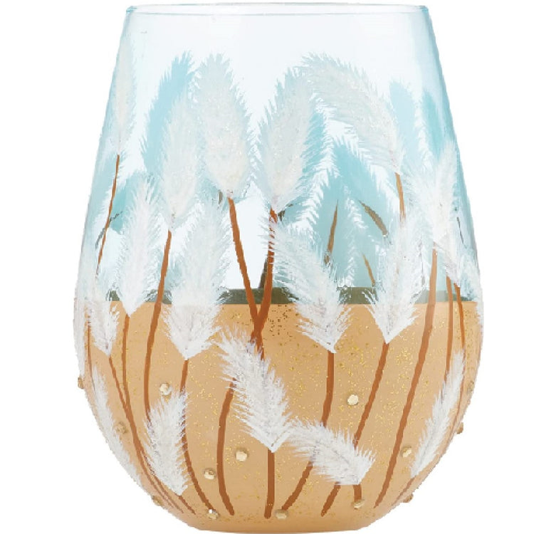 Stemless wine glass with sand colored bottom half of glass with sea grass painted growing out of sand and up glass.