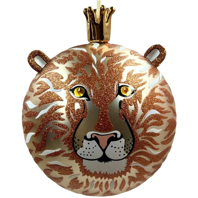 Gold ball ornament with orange glitter accents to look like a lion.