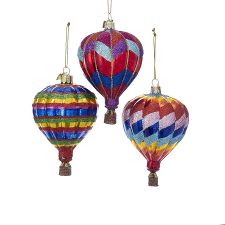 3 blown glass hot air balloon ornaments. 1 is rainbow striped. 1 blue, red & purple zig zag. 1 is rainbow zig zag.