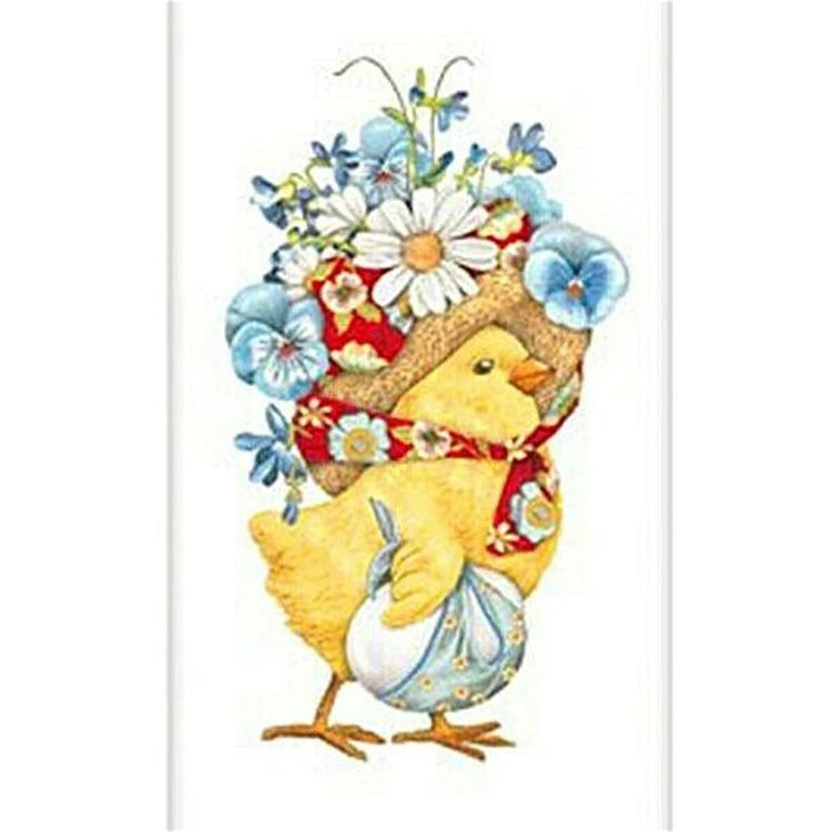 Chick with a bonnet with flowers in it. It is holding an egg in a knapsack.