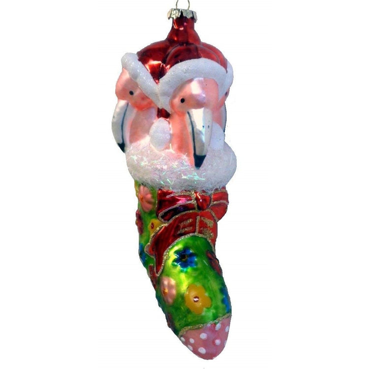 Glass pink & green stocking with floral design & red bow. There is 3 flamingos in Santa hats poking out of the stocking.